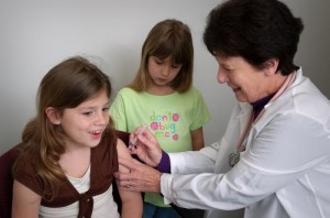 A nurse administers a vaccine as part of the CDC National Immunization Program